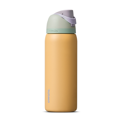 FreeSip 32oz in Beachfront, warm golden yellow insulated bottle with mint green accent band, lavender flip cap, and lavender carry loop